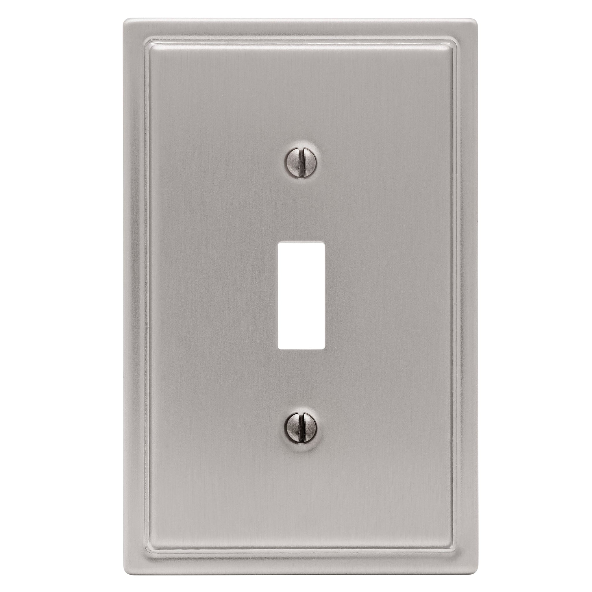 Moderne brushed nickel light switch cover with a unique, art deco-inspired design, featuring sleek lines and a sleek, contemporary finish.