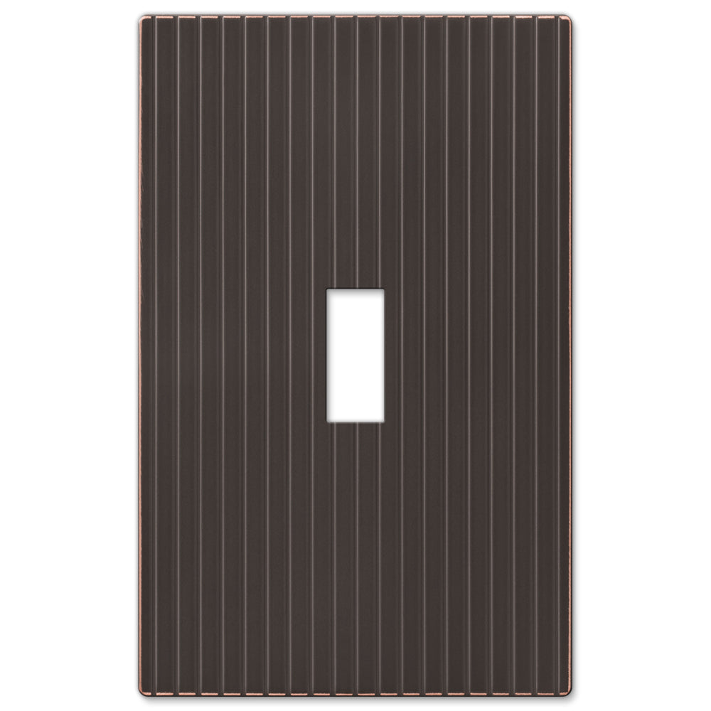 Mies screwless light switch cover with a sleek, modern design and seamless bronze finish for a clean, refined look.