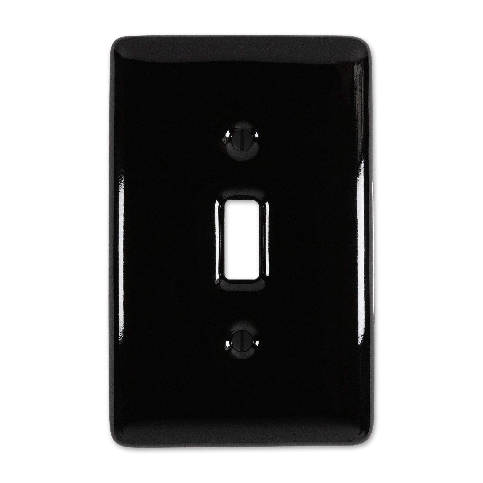 Metro-style light switch cover in a black color, with a sleek, modern design and shiny finish, offering a subtle and stylish accent for contemporary interiors.