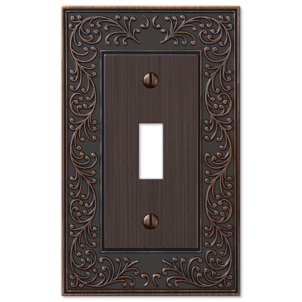 An aged bronze light switch cover from the English Garden collection, featuring a rich, dark finish with delicate highlights that enhance its intricate, vintage-inspired design. The gently weathered patina evokes timeless elegance, reminiscent of classic garden motifs.