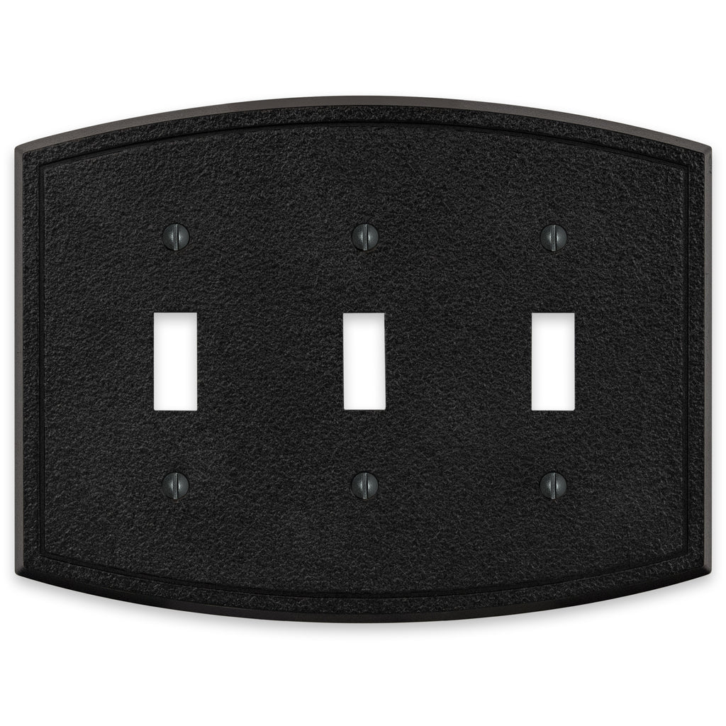 Black iron triple light switch cover with a rugged, textured surface and a sturdy, industrial design, bringing a bold, rustic accent to the room.
