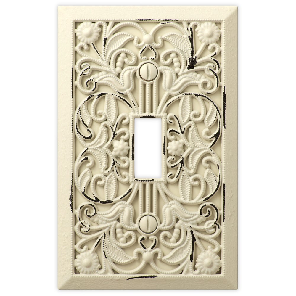 Filigree antique white light switch cover with an elegant, intricate design and a soft, aged white finish, perfect for adding a touch of vintage charm to your décor.