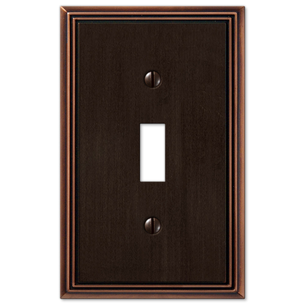 Metro Line light switch cover in aged bronze, featuring a textured, antique finish with a refined, industrial design, adding a vintage touch to modern or rustic decor.