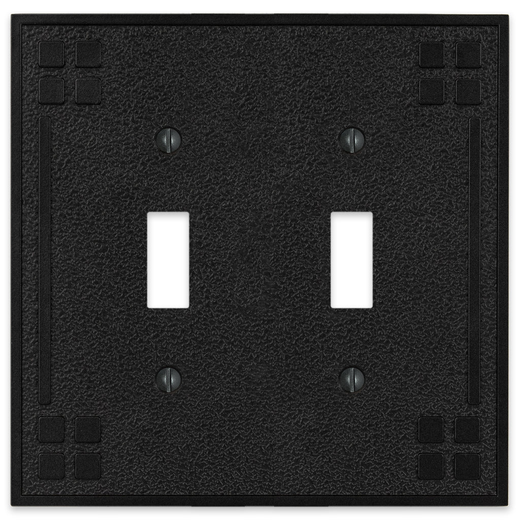 Wittick-style black iron double light switch cover with a rugged, hammered texture and a matte black finish for a rustic, industrial look.