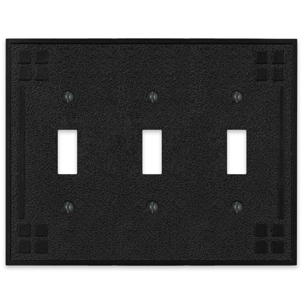 Wittick-style black iron triple light switch cover with a rugged, hammered texture and a matte black finish for a rustic, industrial look.
