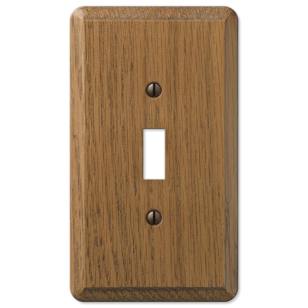 Medium oak light switch wallplate featuring a rich, natural wood grain finish in a warm, medium-brown tone. The smooth surface and distinct texture bring a sense of warmth and sophistication, making it a versatile choice for both traditional and rustic interiors