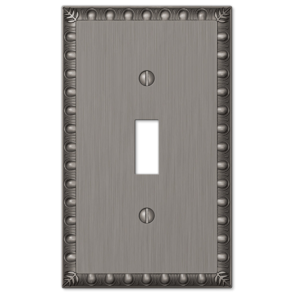 An antique nickel light switch cover with a subtly weathered finish. The cover features a soft, muted surface with slight tarnishing, giving it a vintage, elegant look.