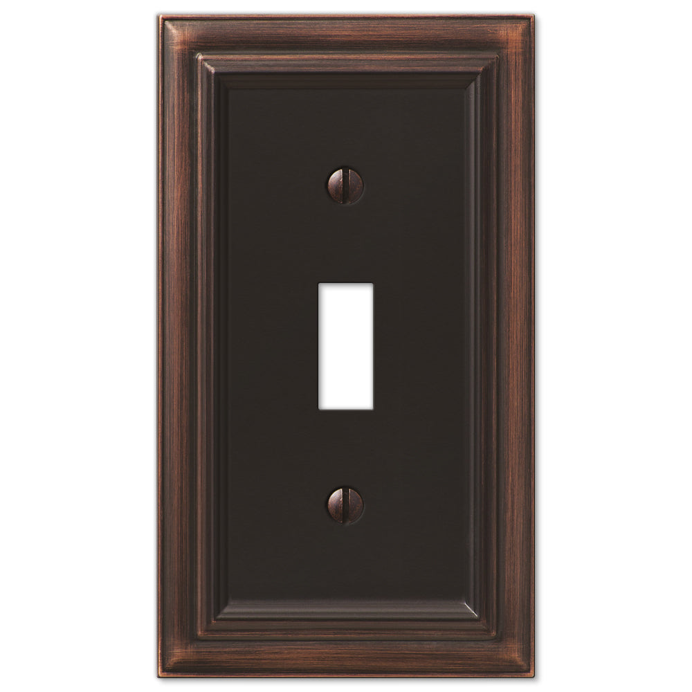 aged bronze light switch wallplate featuring a rich, dark finish with subtle distressed details. The timeless design and warm bronze tones add a touch of vintage charm and sophistication, making it an ideal accent for classic or traditional interiors