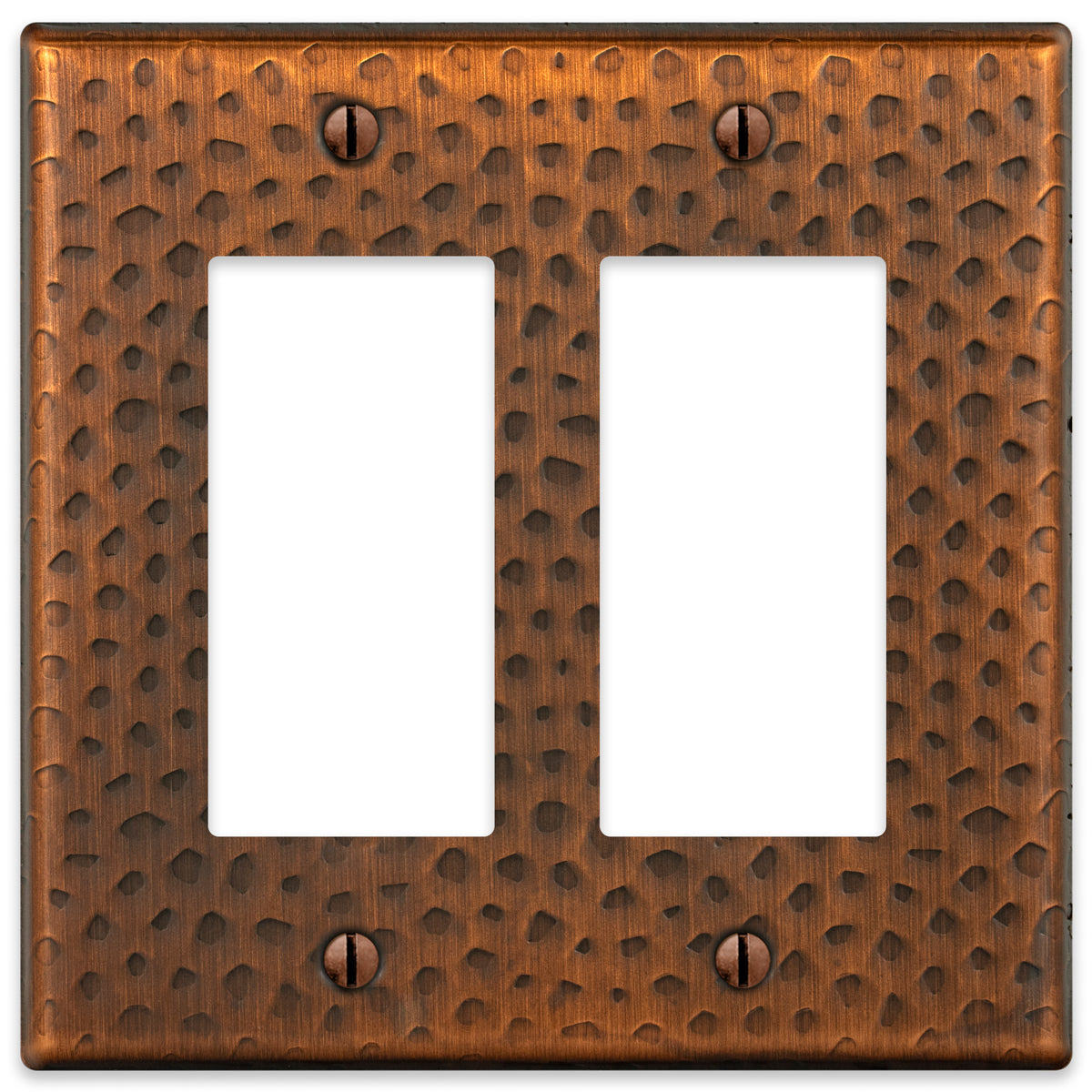 A hammered aged copper double dimmer wallplate featuring a textured surface with a warm, rustic copper finish, adding character and artisanal charm to traditional or farmhouse-style spaces.