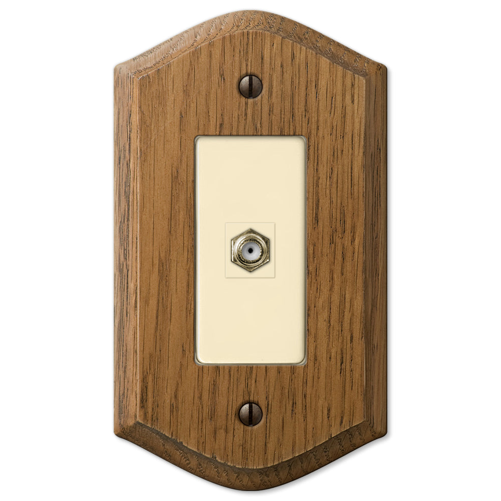 Country-style medium oak cable access wallplate with a warm, natural wood grain and slightly weathered finish. The rustic charm and cozy, lived-in feel make it an ideal accent for country, farmhouse, and vintage-inspired decor styles.