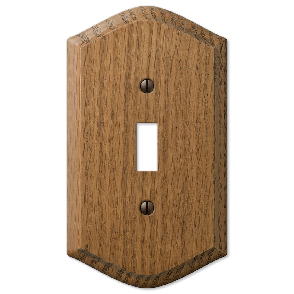 Country-style medium oak light switch wallplate with a warm, natural wood grain and slightly weathered finish. The rustic charm and cozy, lived-in feel make it an ideal accent for country, farmhouse, and vintage-inspired decor styles.