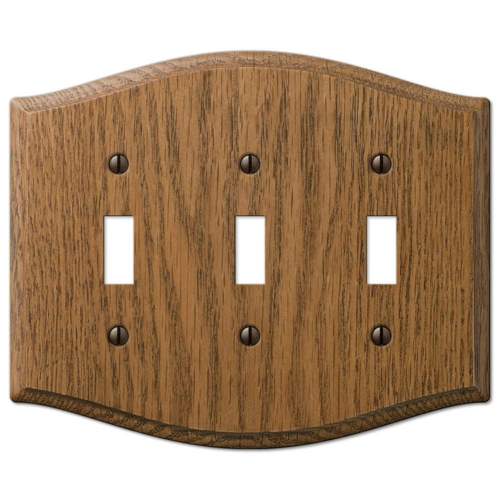 Country-style medium oak triple light switch wallplate with a warm, natural wood grain and slightly weathered finish. The rustic charm and cozy, lived-in feel make it an ideal accent for country, farmhouse, and vintage-inspired decor styles.