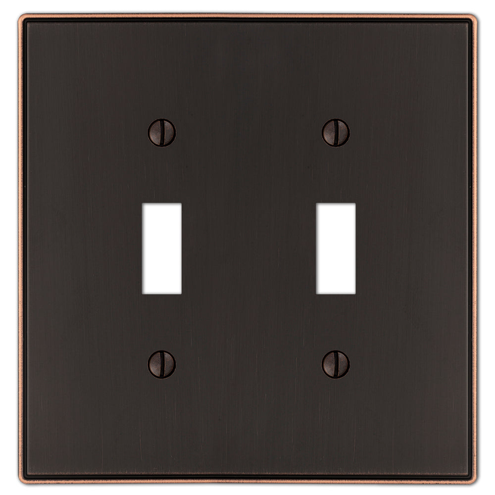 The Halle aged bronze double light switch cover features a sophisticated design with smooth edges and a warm, dark bronze finish, perfect for adding a subtle touch of classic charm to traditional or transitional spaces.